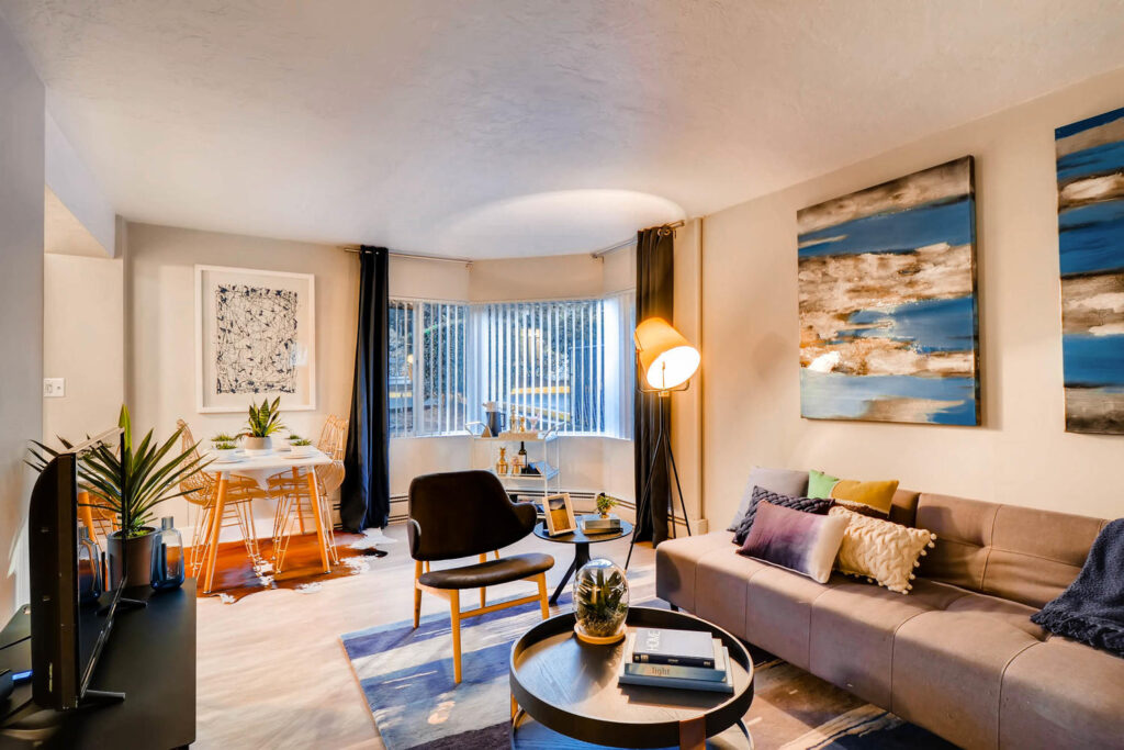 Living room with large windows at Park Plaza student housing in Portland