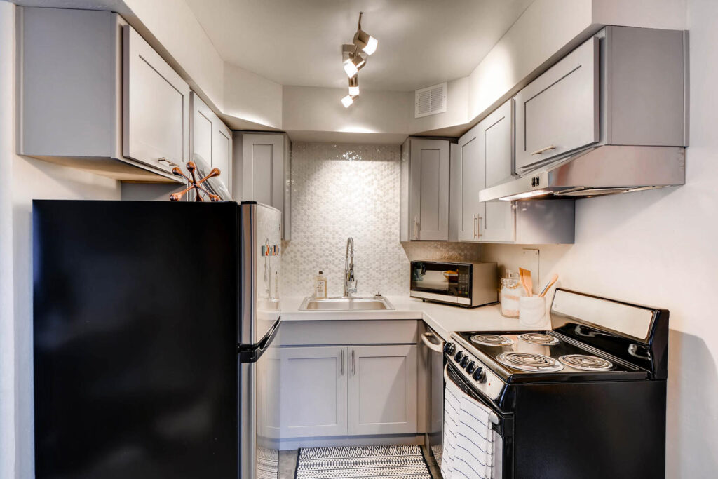 Kitchen with stainless steel appliances at Park Plaza apartments in Portland