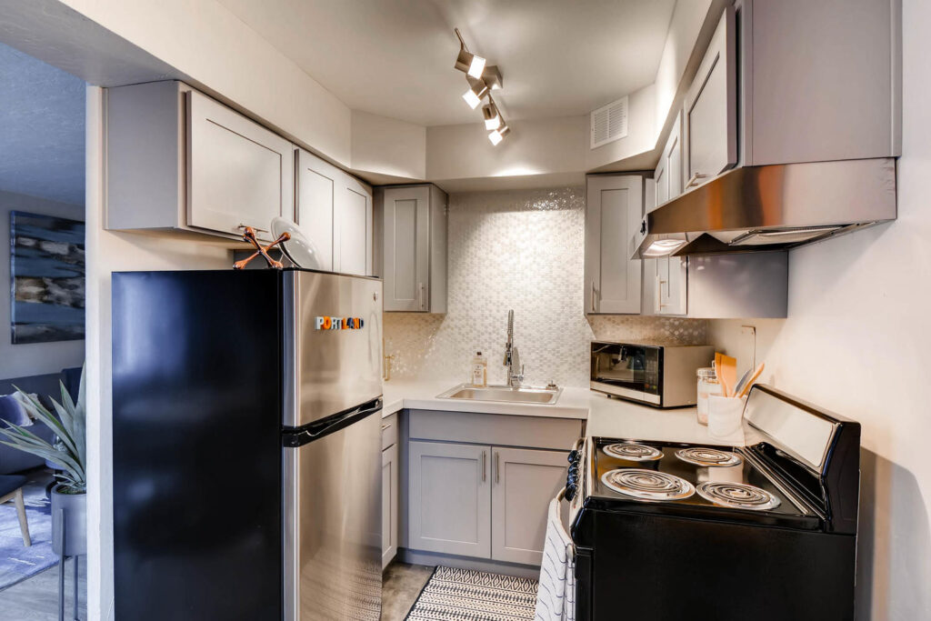 Kitchen with stainless steel appliances at Park Plaza apartments in Portland