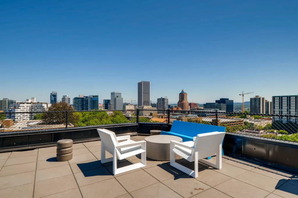 Rooftop with city skyline views, deck seating