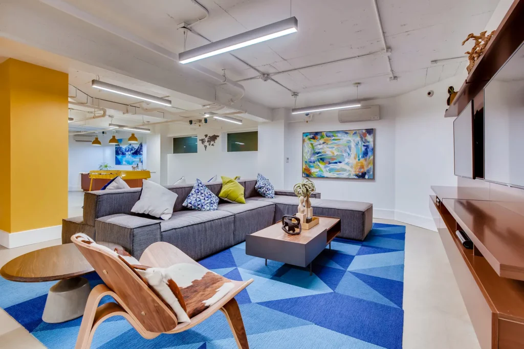 clubhouse lounge with sofas and TVs