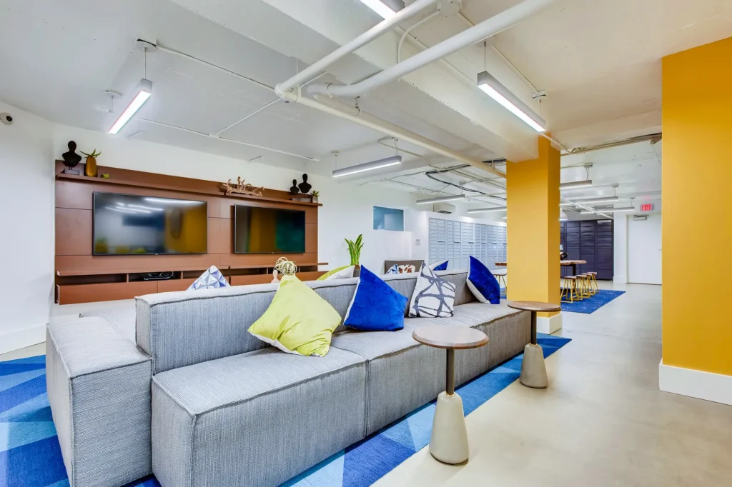 Clubhouse lounge with view of mail room